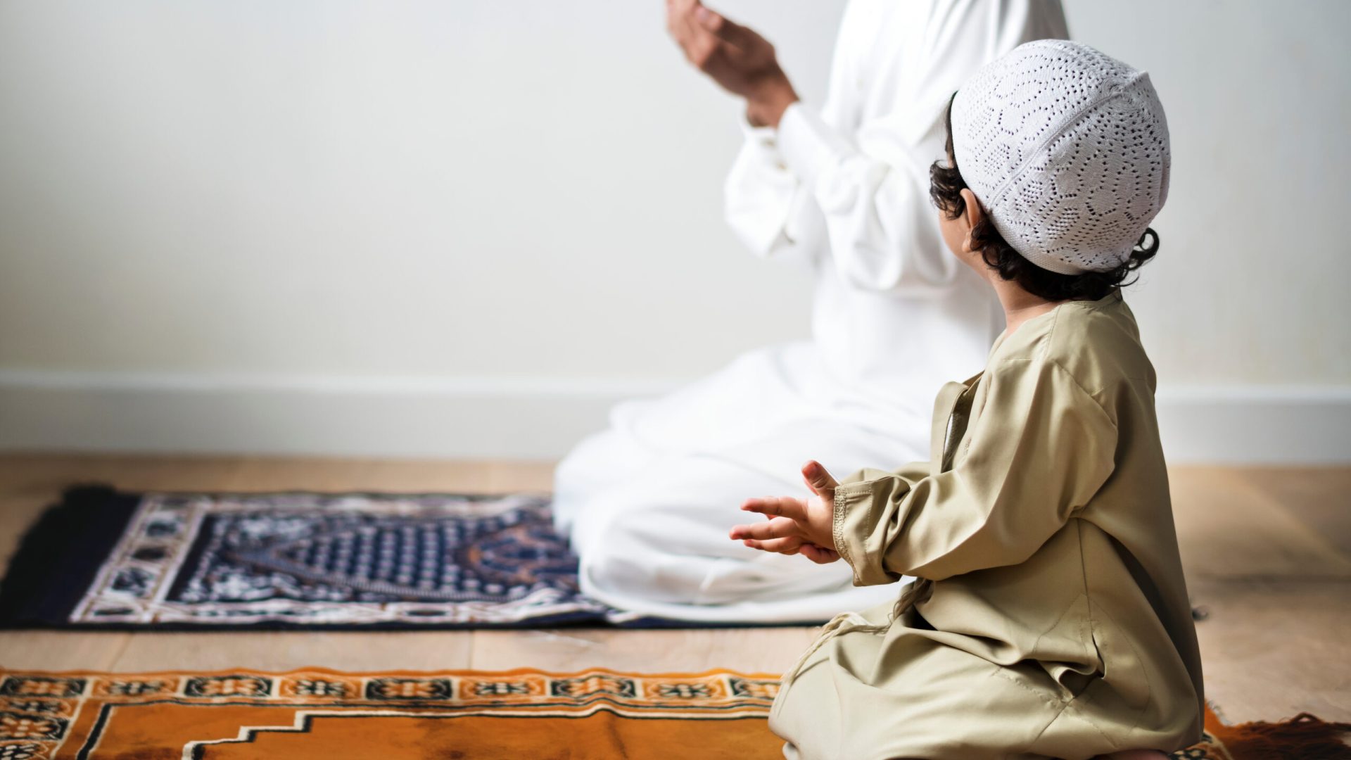 Little,Boy,Praying,Alongside,His,Father,During,Ramadan