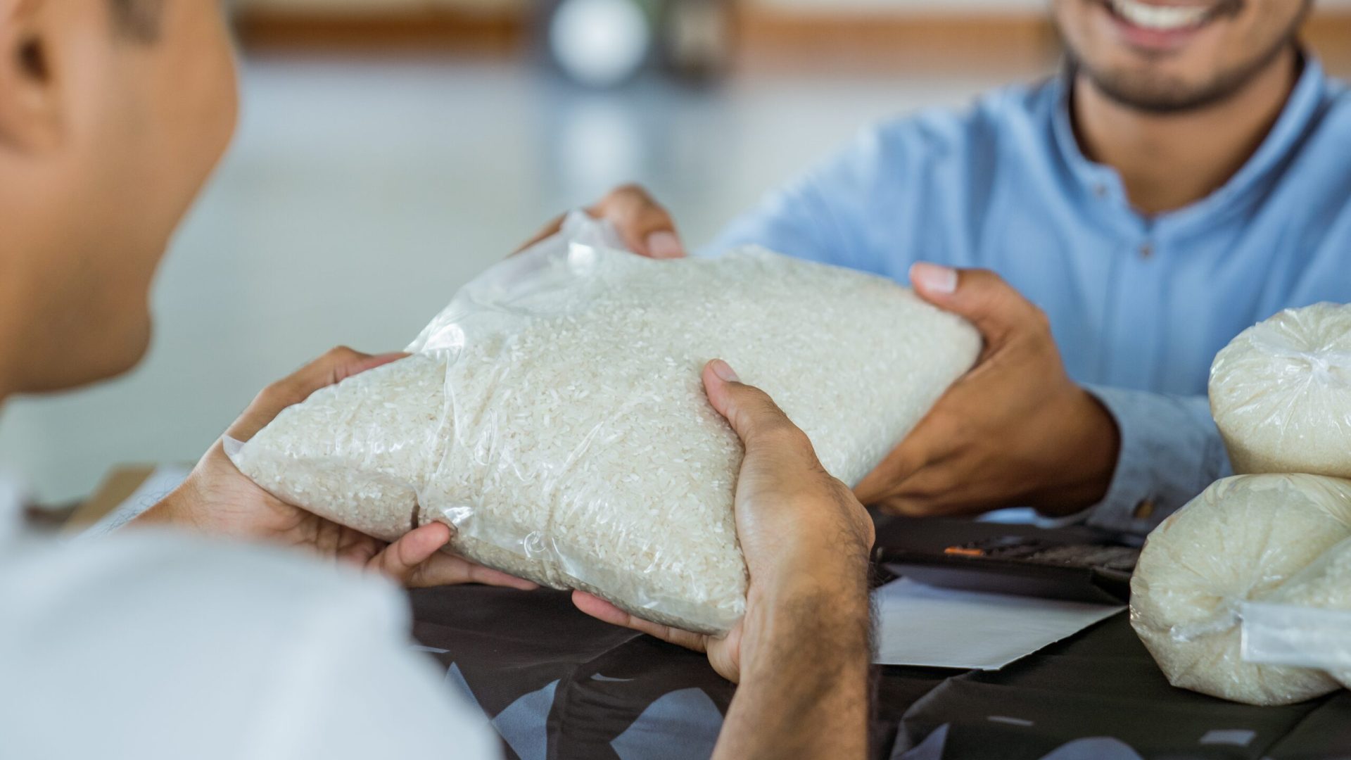 Muslim,Man,Giving,A,Rice,As,A,Food,Donation,For