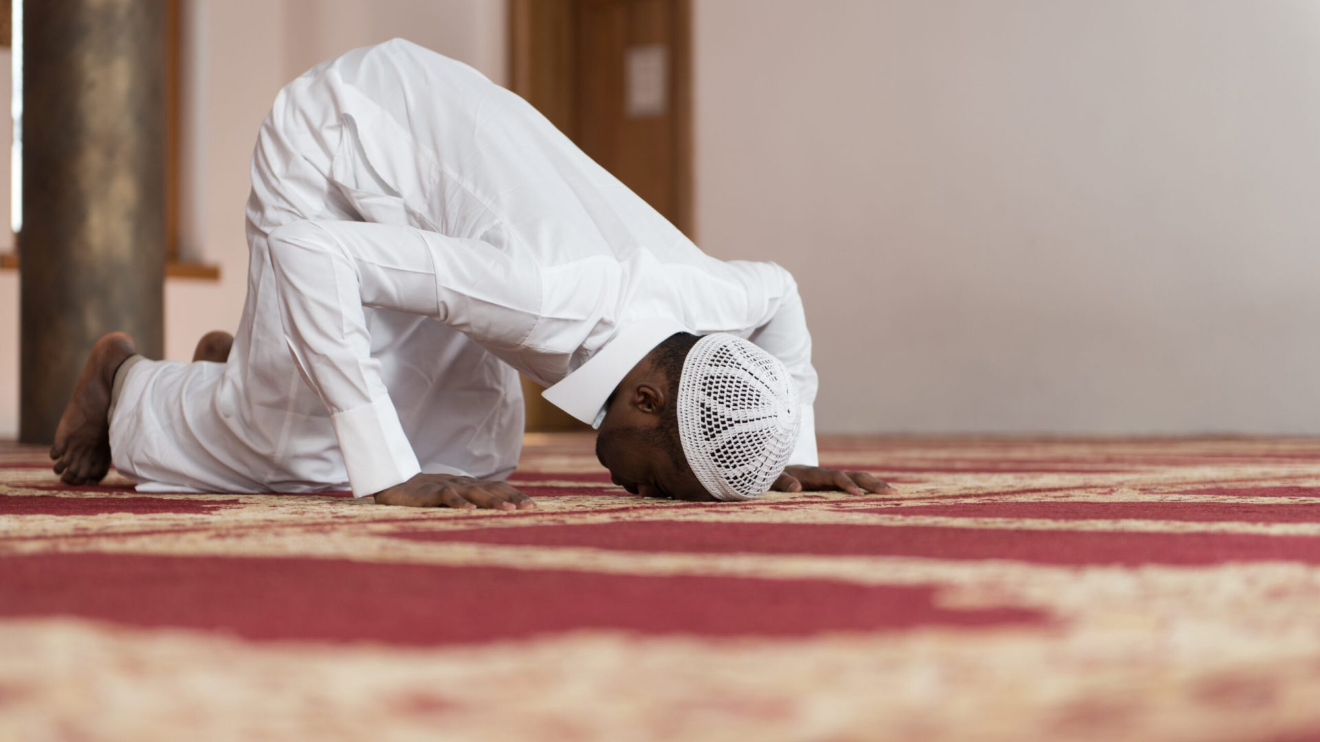 African,Muslim,Man,Making,Traditional,Prayer,To,God,While,Wearing